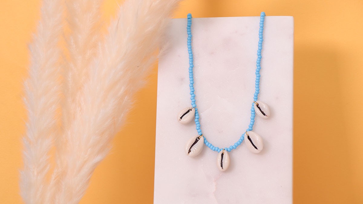 Seed beads and cowrie shell necklace
