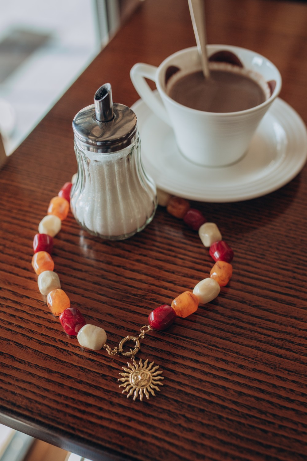 Schema  XXL colored pearl necklace with sun pendant