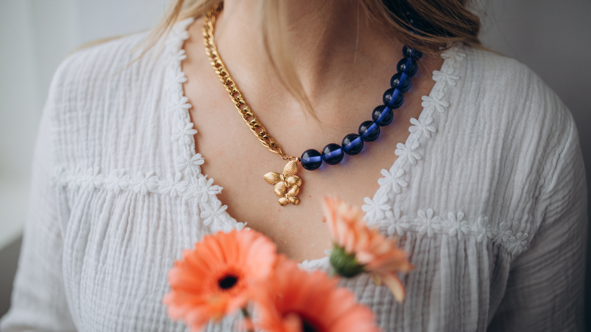Necklace with large beads and butterfly pendant