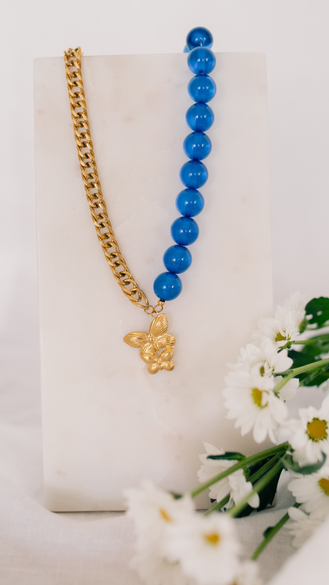 Schema Necklace with large beads and butterfly pendant Schema Necklace with large beads and butterfly pendant