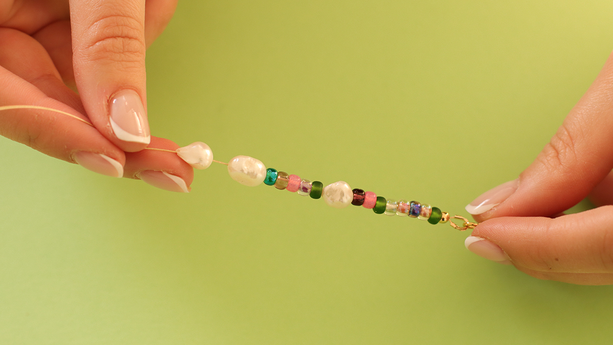 Pink and green necklaces with butterfly pendant and flower beads : Step 4