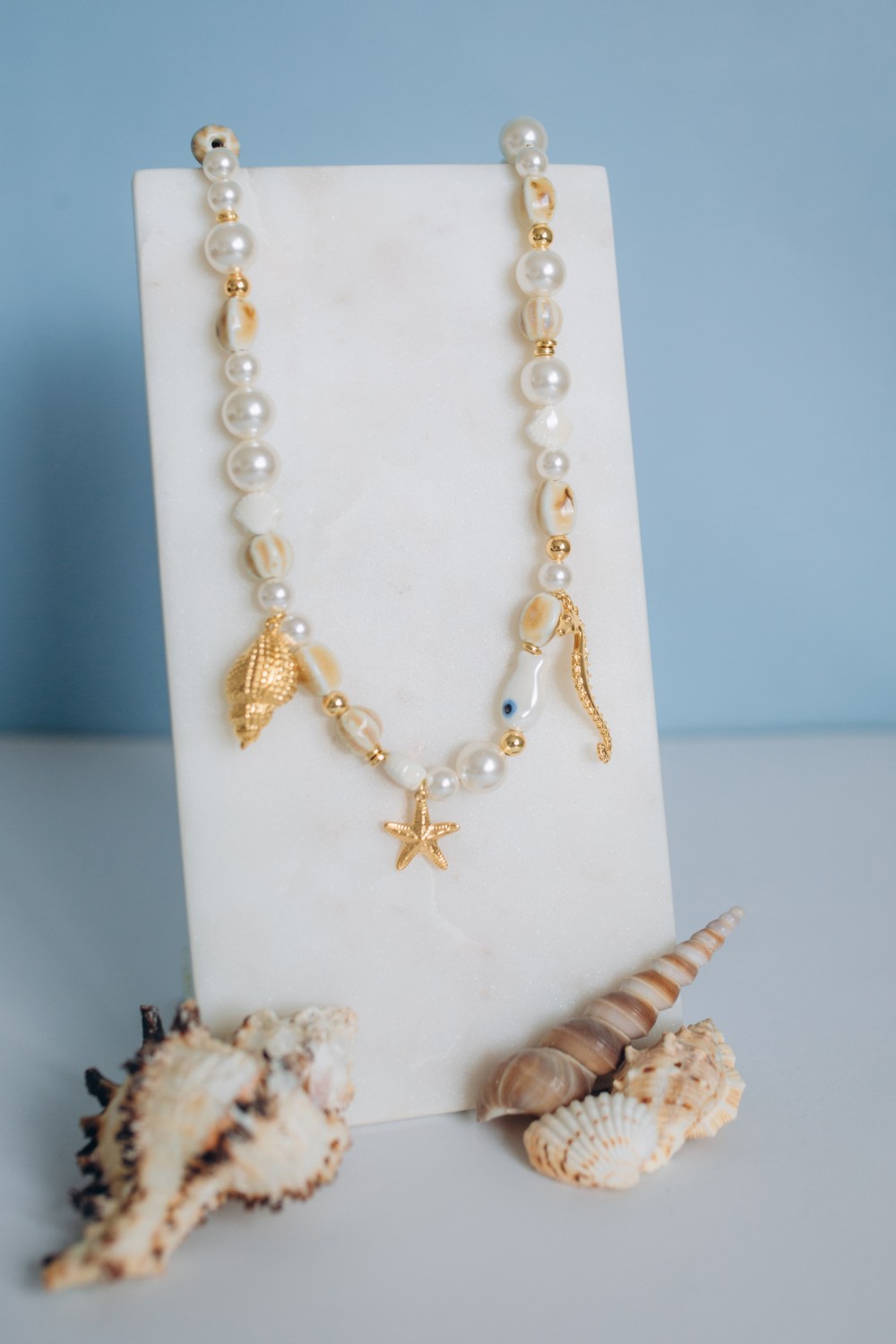 Schema  Necklace with ceramic beads, mother-of-pearl beads and marine charms