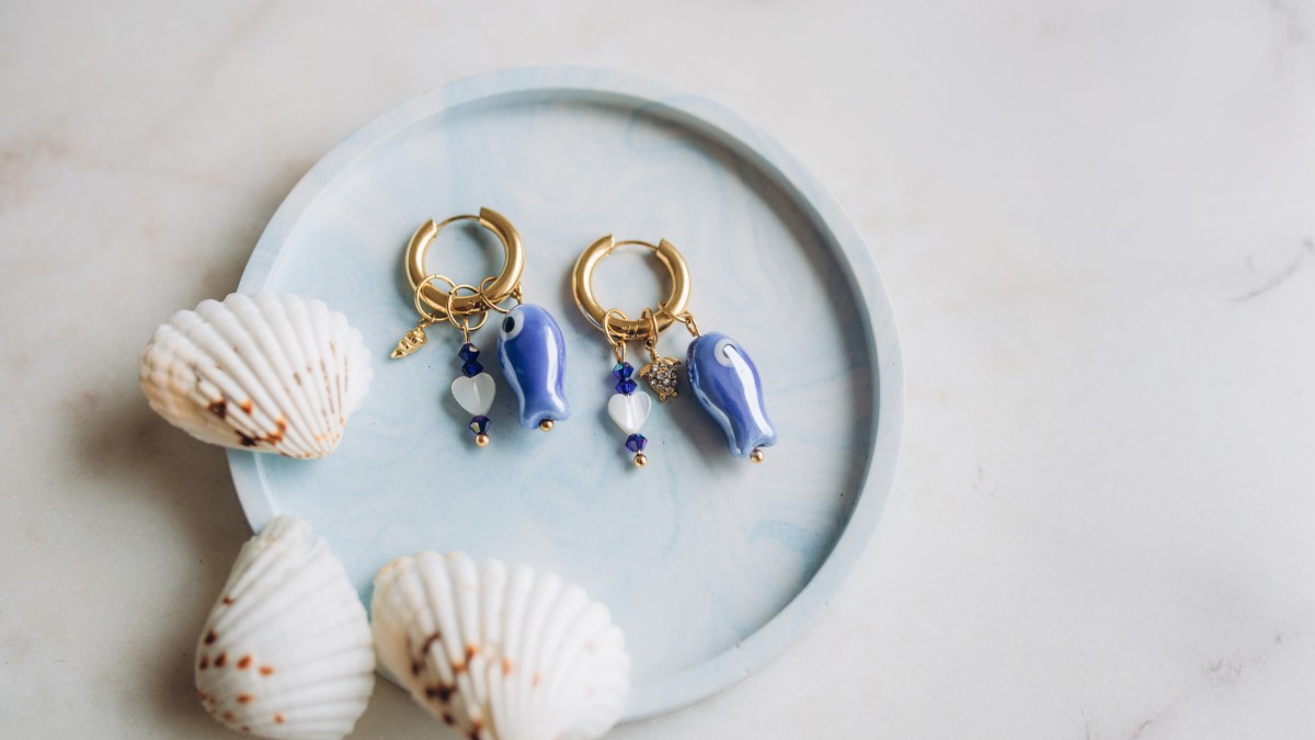Creole earrings with fish pendant