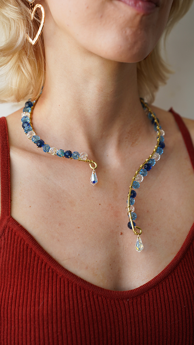 Schema  Brass wire necklace with blue pearls and Swarovski drops