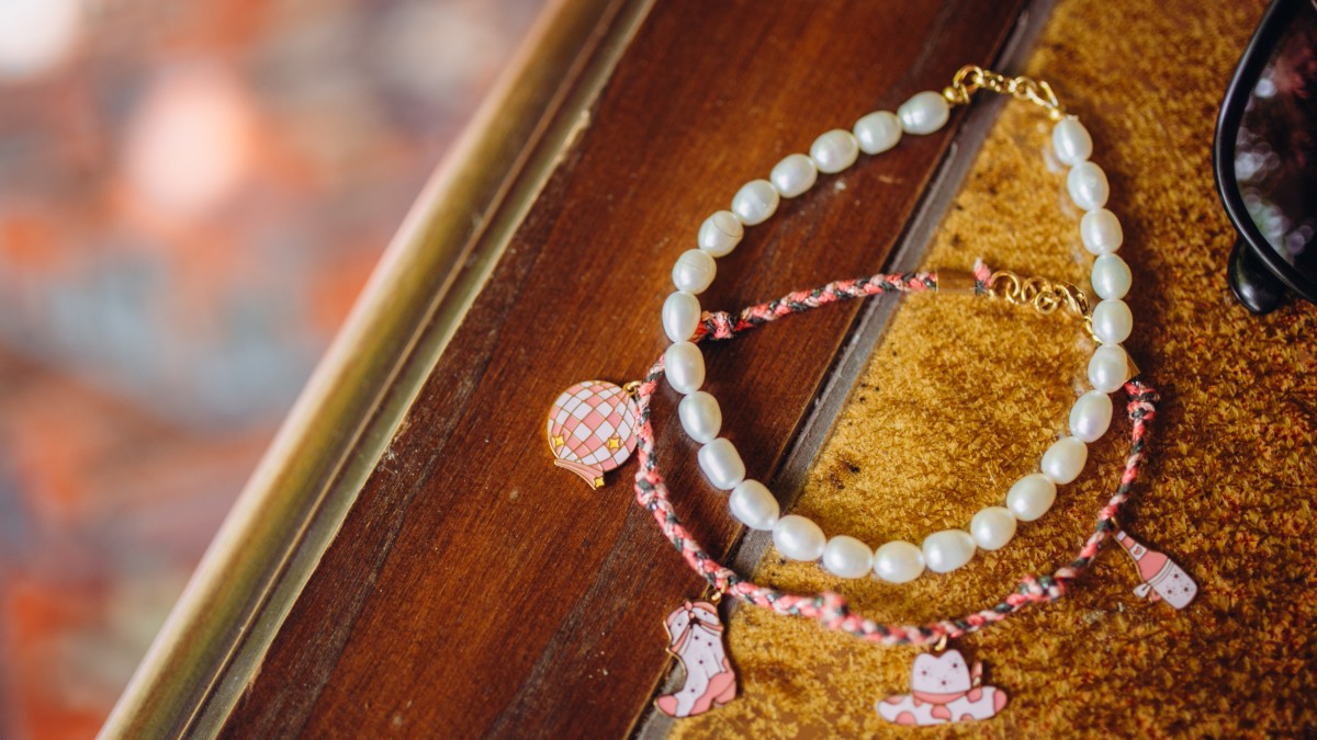 Schema Ankle cord with cowgirl charms and freshwater pearl bracelet Schema Ankle cord with cowgirl charms and freshwater pearl bracelet