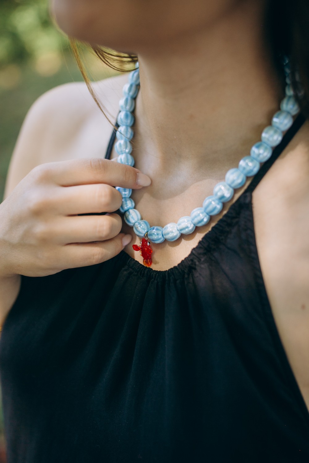 Schema Ceramic bead necklace with glass pendant Schema Ceramic bead necklace with glass pendant