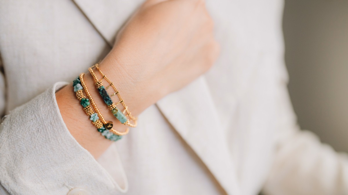 Set of green and gold bracelets in natural stones