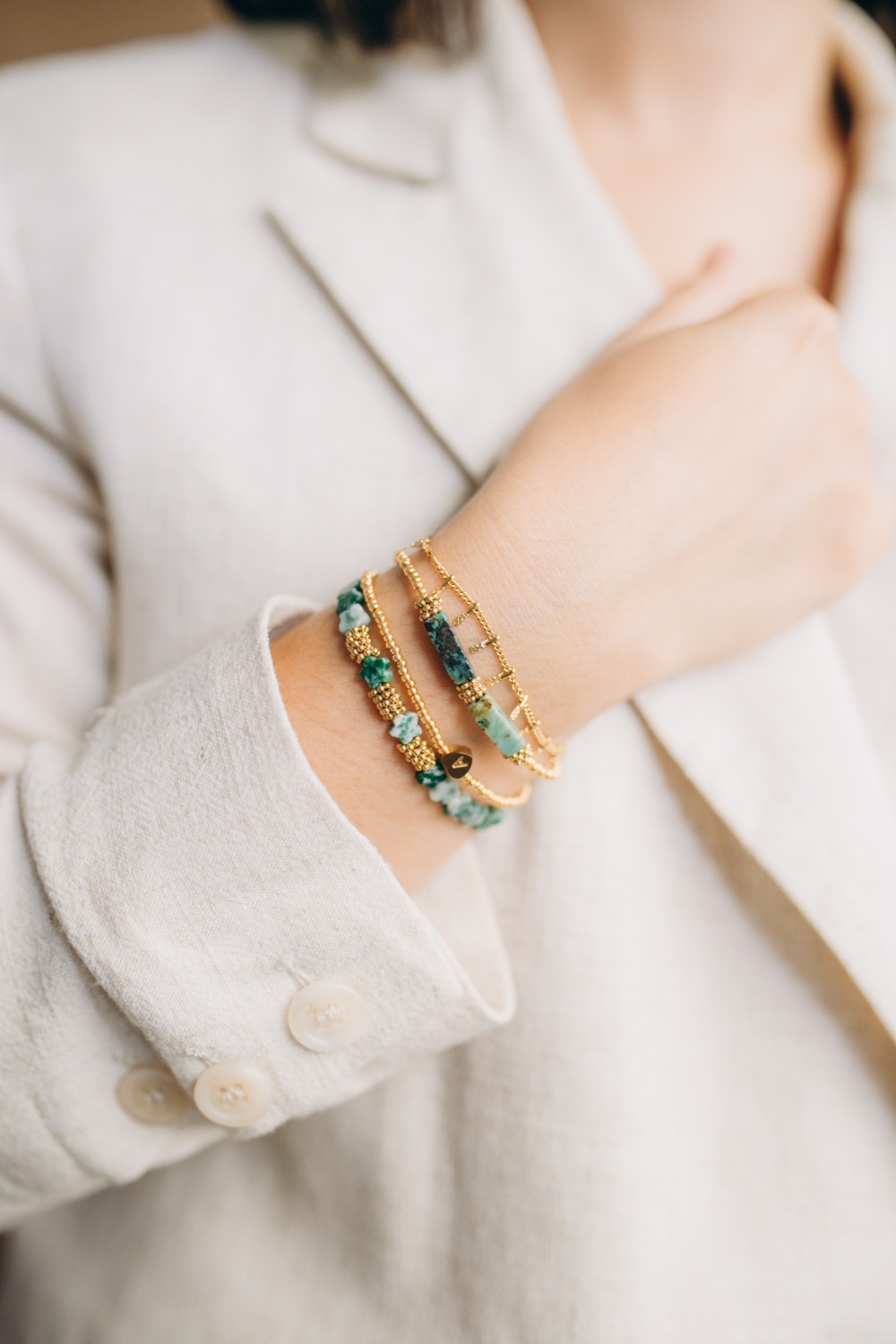 Schema  Set of green and gold bracelets in natural stones