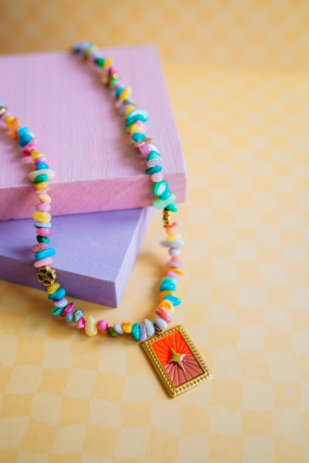 Schema  Multicolored pearl necklace and stainless steel pendant