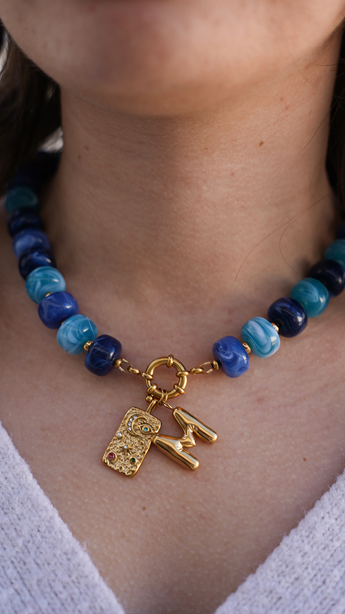 Necklace with large colored acrylic beads and letter pendant