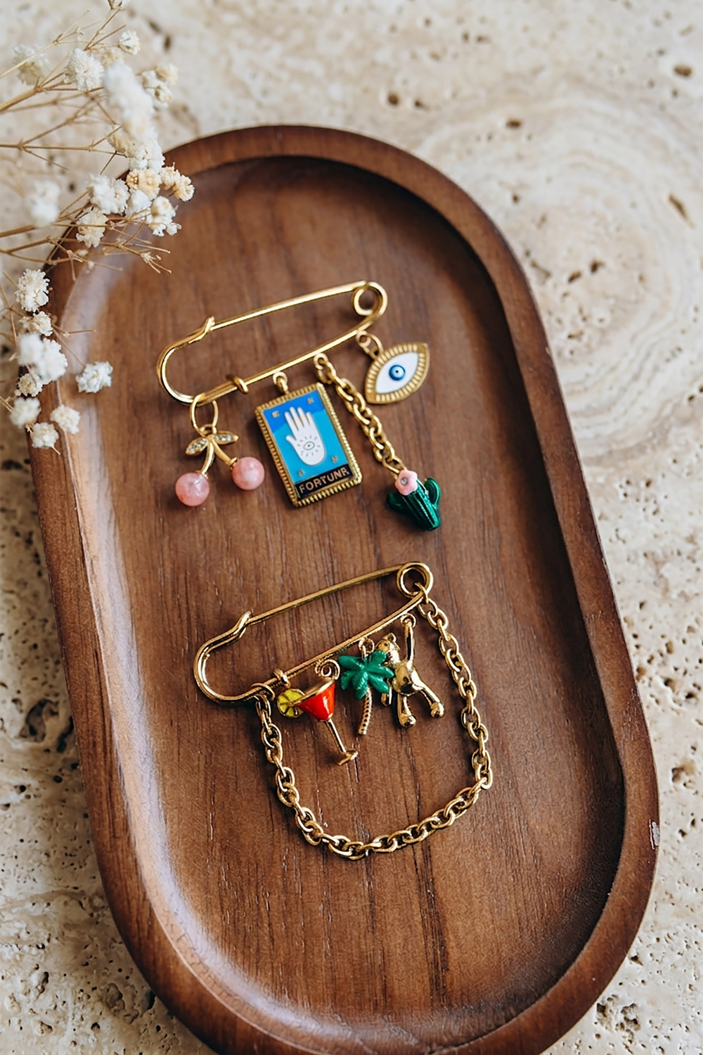 Schema  Charm's safety pin brooch