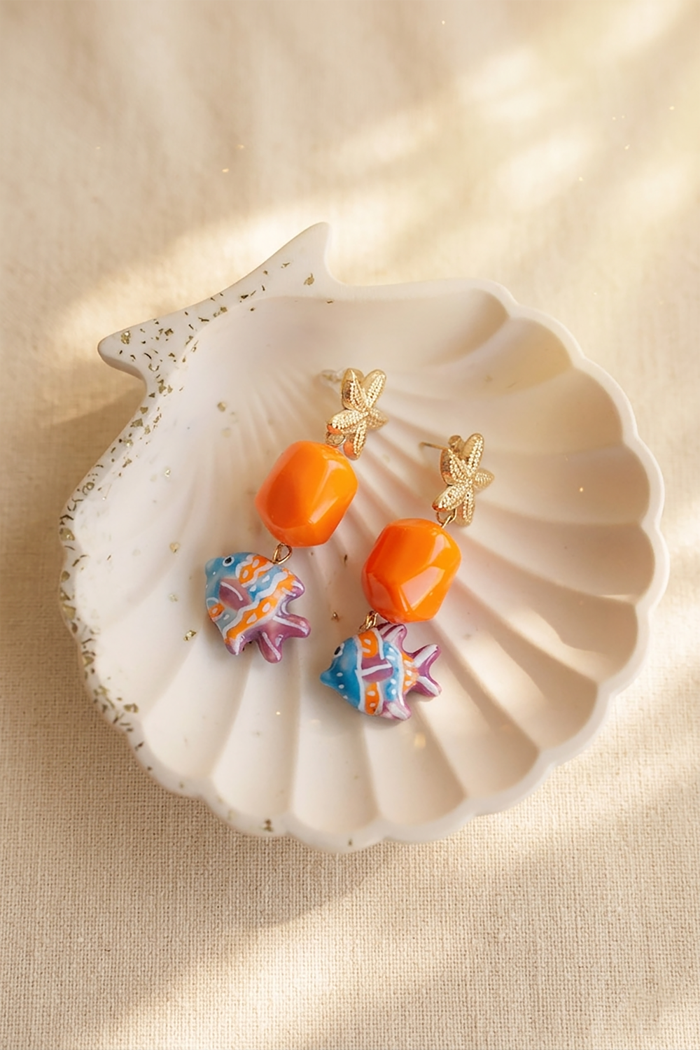 Schema  Starfish and fish pendant earrings