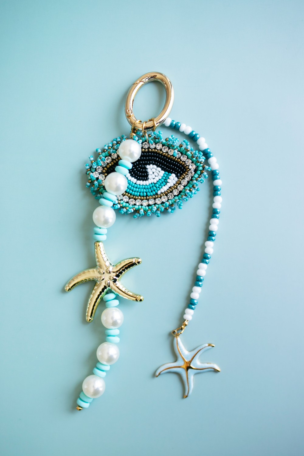 Schema Handbag charm with an embroidered pendant Schema Handbag charm with an embroidered pendant