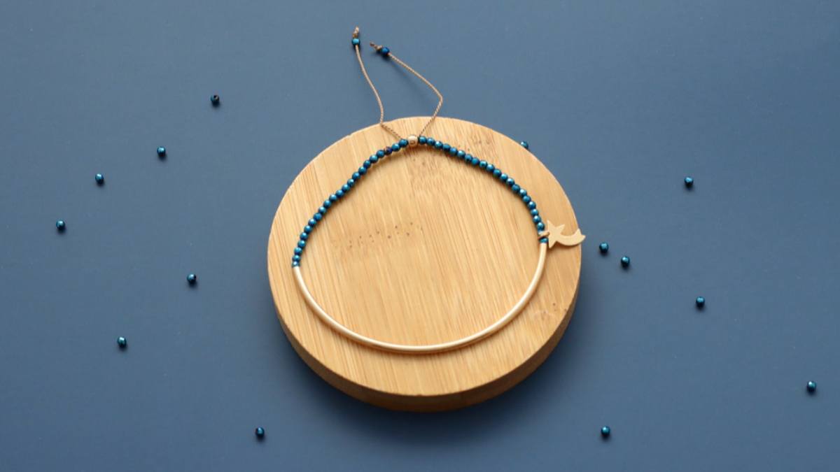 Schema Gold filled half-ring bracelet with blue hematites and shooting star Schema Gold filled half-ring bracelet with blue hematites and shooting star