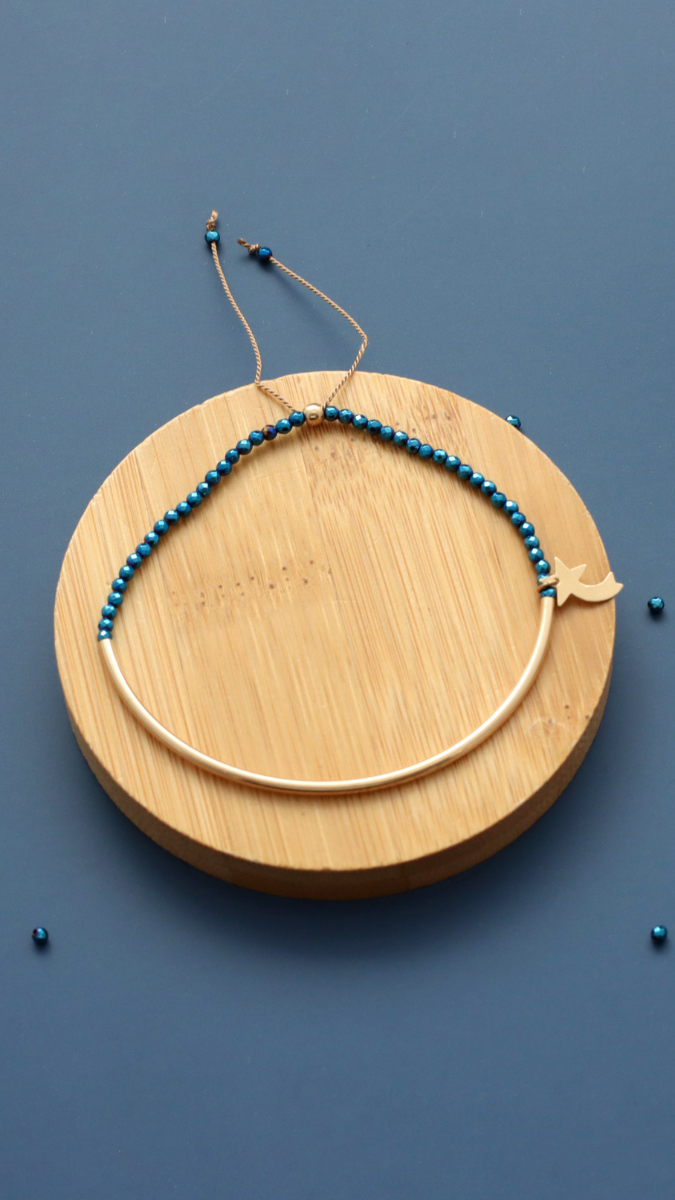 Schema Gold filled half-ring bracelet with blue hematites and shooting star Schema Gold filled half-ring bracelet with blue hematites and shooting star